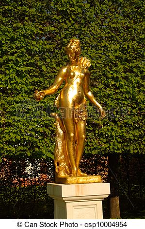 Stock Images of A golden statue of Madona in Schwetzingen Garden.