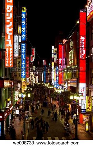 Stock Photo of Busy scene at night with many bright, glowing signs.