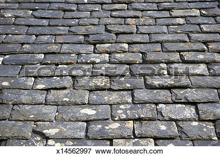 Picture of Old, weathered, heavy slate roof tiles x14562997.