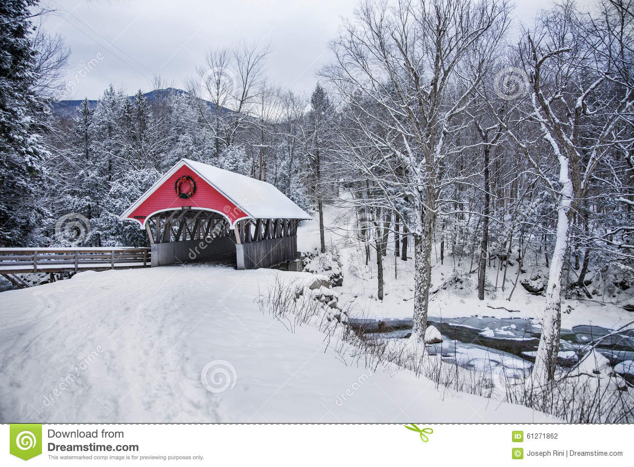 Covered Bridge Snowfall In Rural New Hampshire Stock Photo.