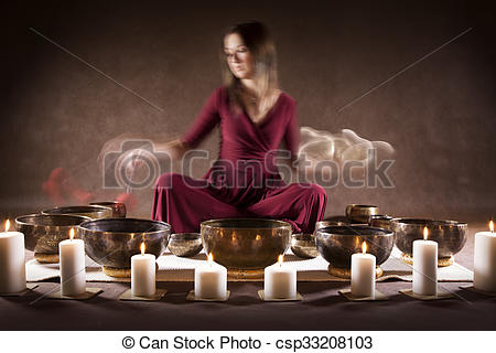 Stock Photography of Meditation with Tibetan singing bowls.
