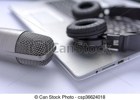 Stock Photography of Microphone and headphones on laptop. sound.
