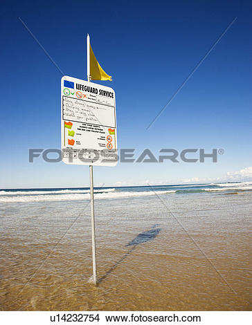 Stock Photo of Sign and flag on beach in Surfers Paradise.