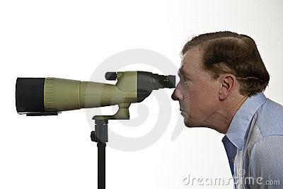 Man Looking Through A Spotting Scope Royalty Free Stock.