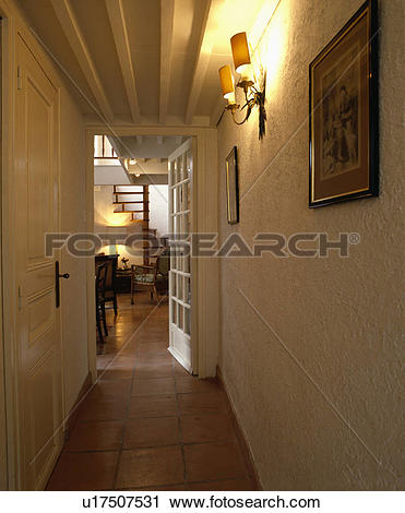 Stock Photography of Terracotta tiled floor and roughly plastered.
