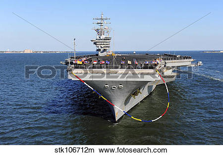 Stock Photo of Sailors man the rails aboard USS Dwight D.
