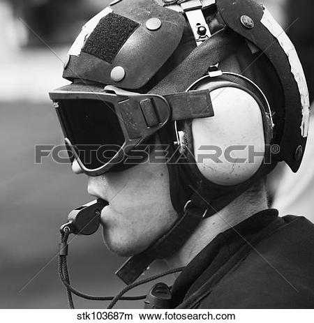 Stock Photo of A Sailor supervises flight operations aboard the.