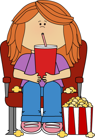 Girl in movie theater with movie snacks..