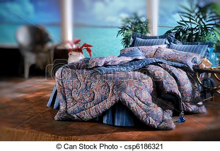 Stock Photography of Bed room set with bedding and window light.