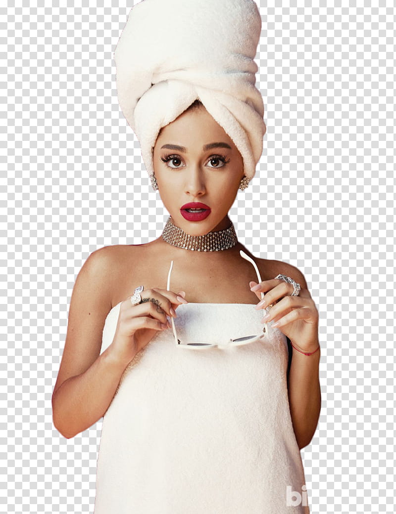Ariana Grande, woman in white bath towel holding sunglasses.