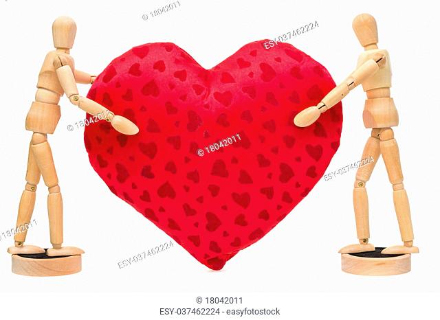 Wooden mannequin holding red heart Stock Photos and Images.